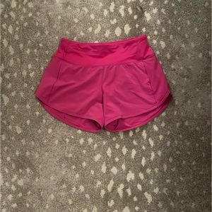 Lululemon Ripened Raspberry speed up shorts.